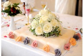 Wedding cake decorated with roses in pastel colors