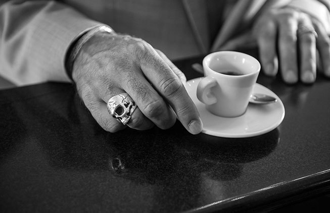 Groom having an espresso in a typical Italian cafe