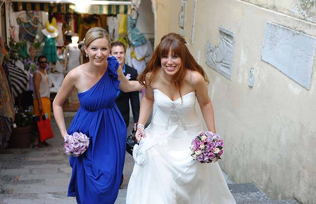 Bride and bridesmaid walking in the streets of Positano