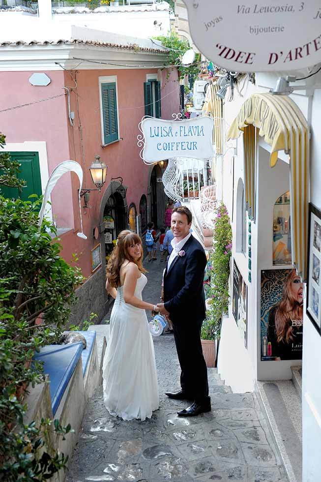 Bridal couple strolling in the streets of Positano