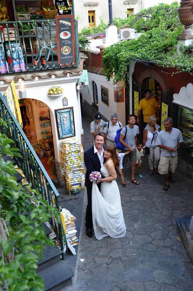 Bridal couple walking in the streets of Positano