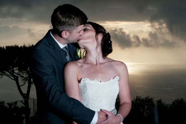 Romantic kiss of a bridal couple in Sorrento