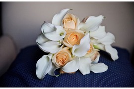 Bridal bouquet with orange roses white calla lilies