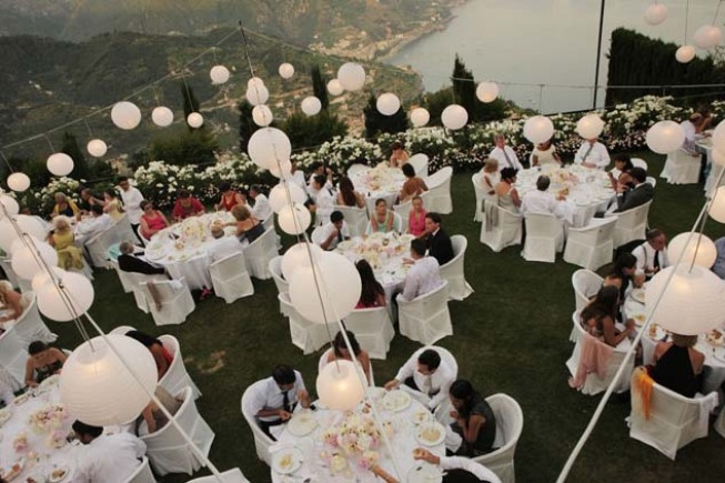 Decoration with white paper lanterns for outdoor wedding reception