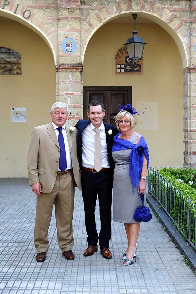 Groom and parents going to the ceremony in Amalfi